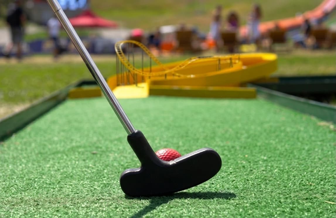 Mini golf putter and ball at outdoor event